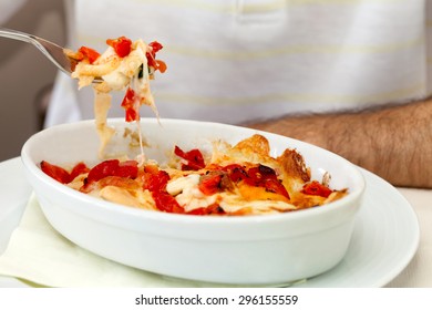 Man Eating A Variety Of Lasagna Made With Carasau Bread, Typical Mediterranean Recipe From Sardinia.