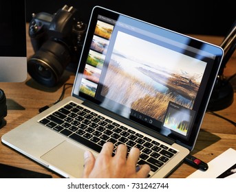 Man Editing Photos On A Computer