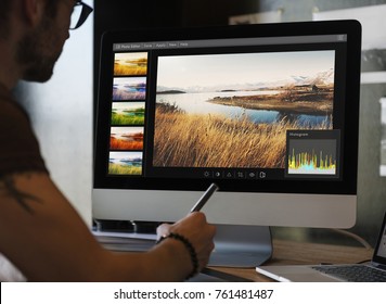 Man Editing Photos On A Computer