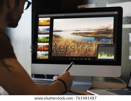 Man editing photos on a computer
