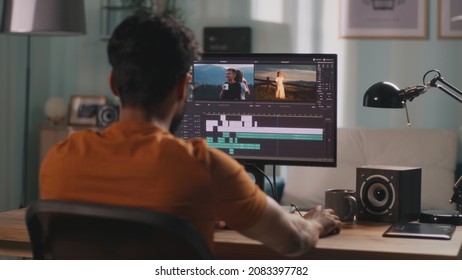 Man editing video on computer - Shutterstock ID 2083397782