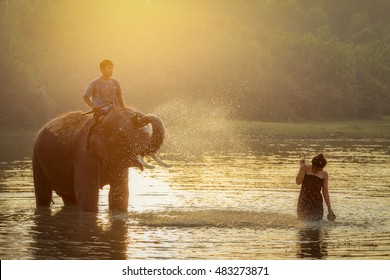silhouette-elephant-man-take-bath-river-stock-photo-407297650-shutterstock