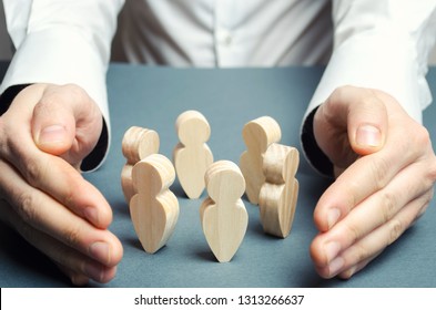 A man embraces a circle of human figures. Care and protection, insurance team. Patronage of communities and groups. Creating the conditions for negotiations and probing, cooperation of people. - Shutterstock ID 1313266637