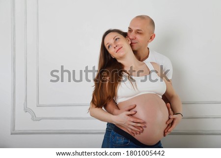 Similar – Pregnant woman embraced by her husband