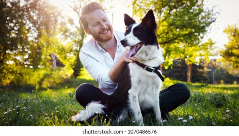 Man Embracing His Dog