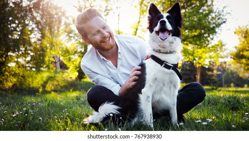 Man Embracing His Dog