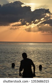 Man Emerging From The Ocean. Phuket, Thailand. 