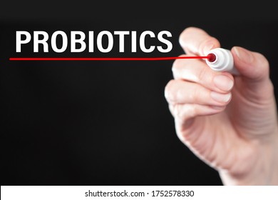 Man Emphasizes Inscription Probiotics. Hand Of A Human With A Marker. Use Of Probiotics To Support Immunity. Creation Of Biological Probiotics. Use Of Dietary Supplements. Human Health. Treatment