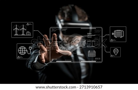 A man engages with a virtual reality interface showcasing energy management solutions, emphasizing battery systems and innovative technology for future developments.