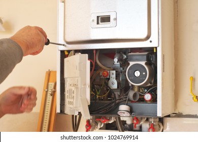 Man engineer and gas heater. Repair and work scene.