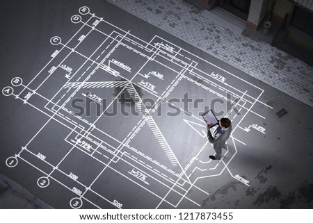 Man engineer thinking over his plan. Mixed media