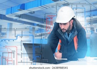 Man engineer of ventilation systems. Designing air-conditioning ducts. Engineer develops industrial utilities via laptop. Man builder studies ventilation drawings. Designing air handling unit
