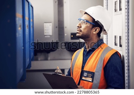 Man, engineering and technician in control room, box inspection and machine maintenance on clipboard. Male electrician, system and electrical substation for power, industrial generator and checklist