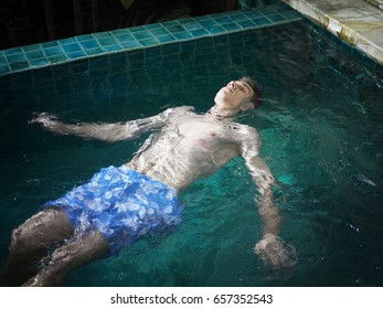 Man Enjoy Floating In The Spa Pool