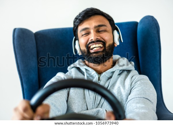 Man enjoying car racing\
game