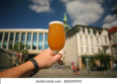 Man Enjoying Fruity Hazy IPA Poured In A Glass  In Old City Centre