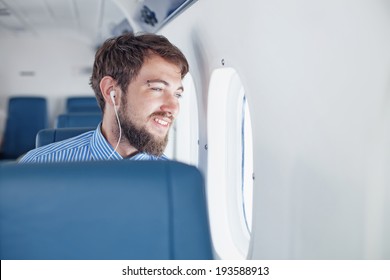 Man Enjoying His Journey By Airplane