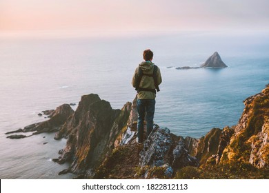 Man Enjoying Ocean View In Norway Active Vacations Hiking Outdoor  Adventure Healthy Lifestyle Father Wearing Baby Carrier Weekend Getaway Leisure Activity