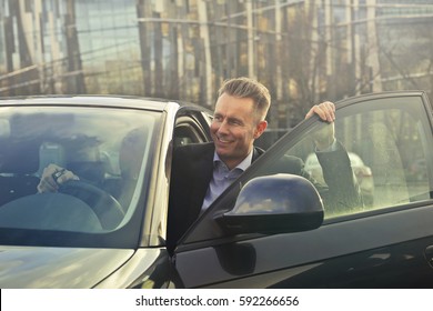 Man Entering A Car