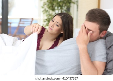 Man with erectile dysfunction during sex with her partner looking disappointed