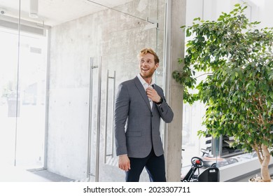 Man Excited Confident Pensive Serious Businessman Male Client 20s Wear Grey Suit Enter Office Business Centre Looking Aside In Dealership Salon Store Office Indoors Business Lifestyle Sales Concept.