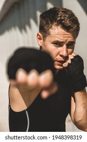 Man Exercising And Fighting In Outside, Boxer In Gloves. Male Boxer Portrait