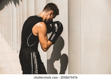 Man Exercising And Fighting In Outside, Boxer In Gloves. Male Boxer Portrait