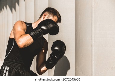 Man Exercising And Fighting In Outside, Boxer In Gloves. Male Boxer Portrait