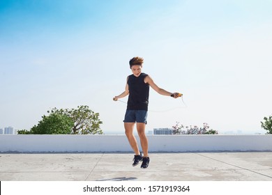 man exercising with jump-rope outdoors - Powered by Shutterstock