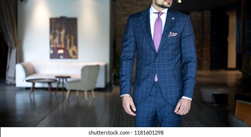 Man In Expensive Custom Tailored Business Suit Posing Indoors