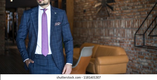 Man In Expensive Custom Tailored Suit Posing Indoors