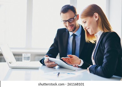 Man Explaining Something To His Young Colleague