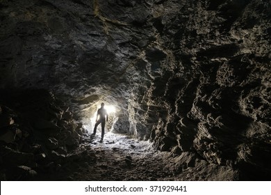 Man Explores A Cave