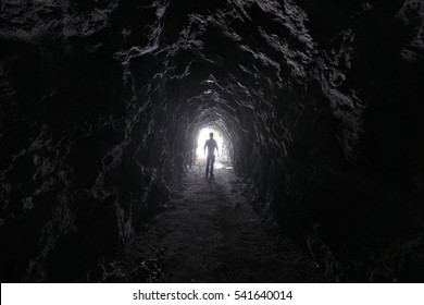 Man Explores A Cave