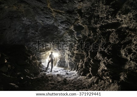 man explores a cave