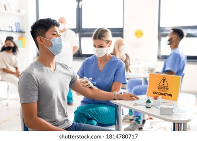 Man With Face Mask Getting Vaccinated, Coronavirus, Covid-19 And Vaccination Concept.