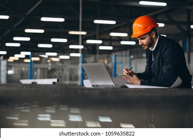 Man At A Factory With Computer