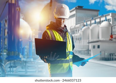 Man factory technologist. Chemical industry. Factory engineer with laptop. Technologist at chemical plant. Man near tanks for storing toxic substances. Plant with high pressure tanks - Powered by Shutterstock