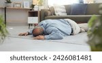 Man, faint and accident on home floor with heart attack, cardiac arrest or unconscious in living room. Mature person on ground and alone with medical risk, emergency and healthcare problem or death