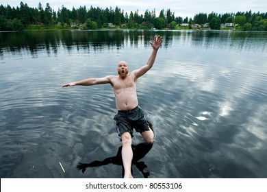 Man Falling Backwards Into A Lake.