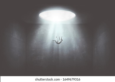 man falling down from a hole of light, surreal concept