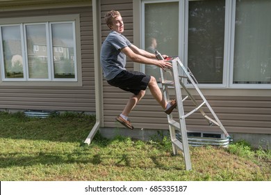 Man falling off a ladder outdoors.