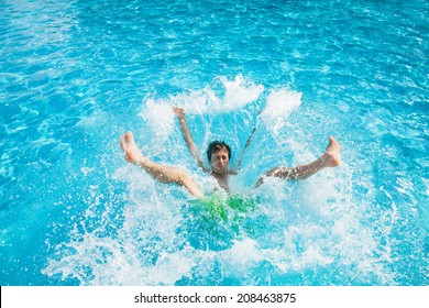 Man falling and splashing into water