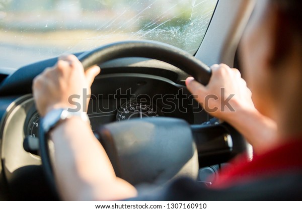 man fast driving a car on the way in the morning\
with selective focus