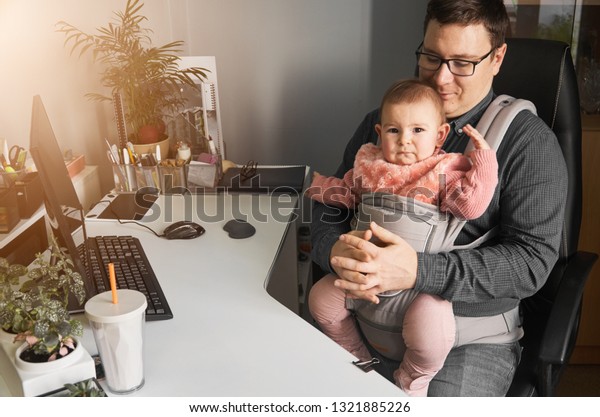 man in baby carrier