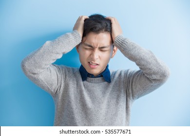 Man Feel Headache With Blue Background, Asian