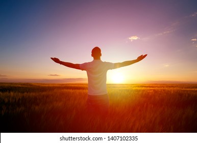 Man feeling free in a beautiful natural setting. - Shutterstock ID 1407102335