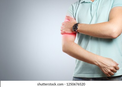 Man Feeling A Pain In His Upper Arm