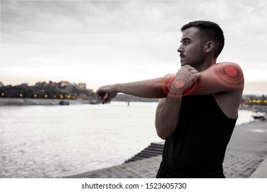 Man Feeling Pain While Stretching Elbow Stock Photo 1523605730 ...