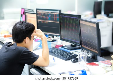 a man feeling stress because he don't stop loss when stock market panic sell - Shutterstock ID 504757639